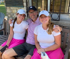 Pictured with his high school-age daughters, stage 4 kidney cancer patient Kerry Gabel's disease has been under control for 2.5 years since doctors at UTSW increased the conventional dosage level of an approved drug.